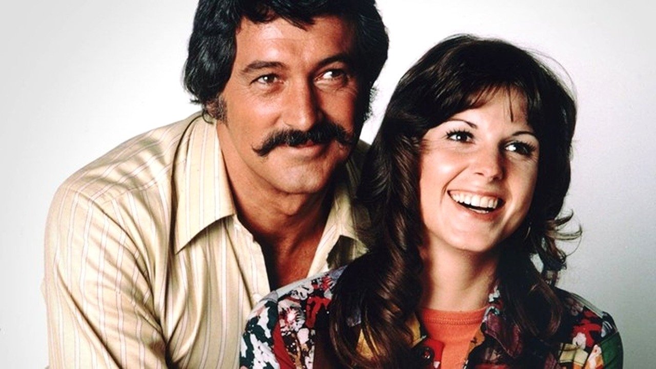 McMillan y esposa